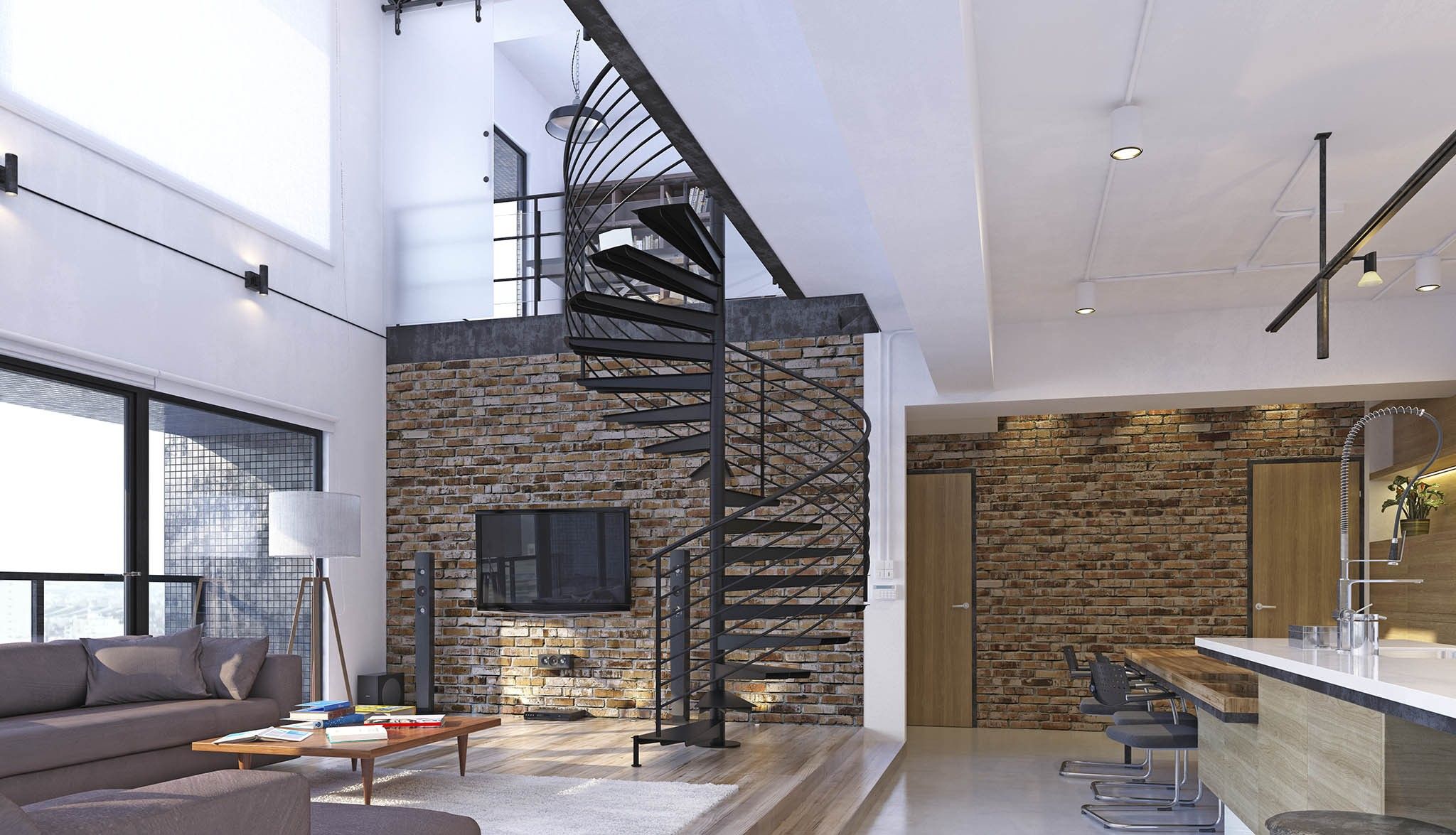 Loft con escalera de caracol, pared de ladrillo visto y cocina abierta